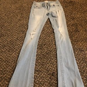 Light wash destroyed flare jeans